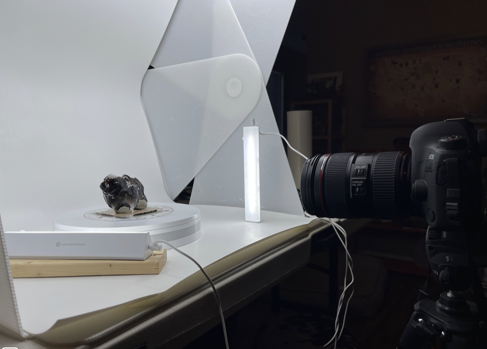 camera pointing at an artifact in a photo studio