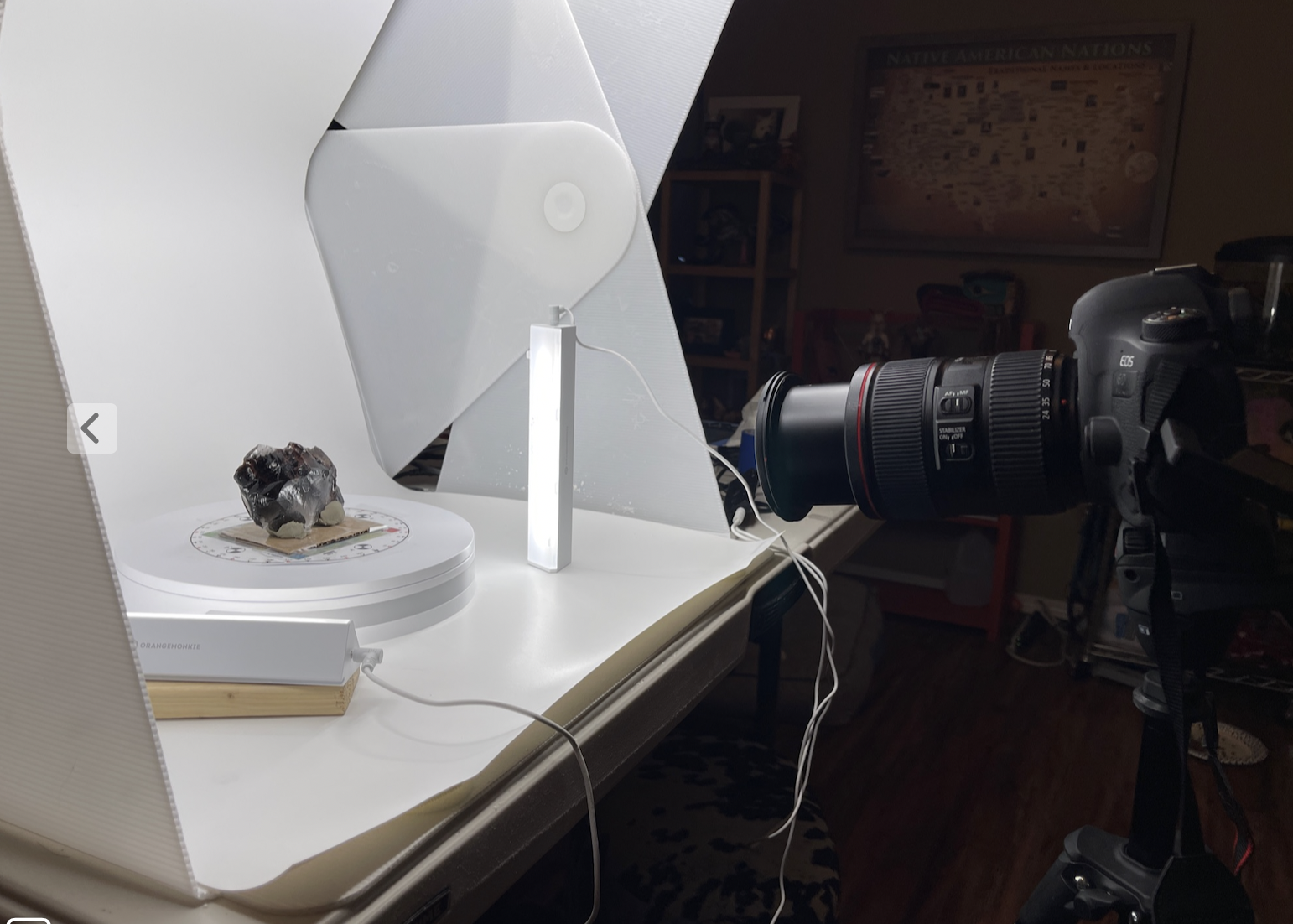 camera pointing at an artifact in a photo studio